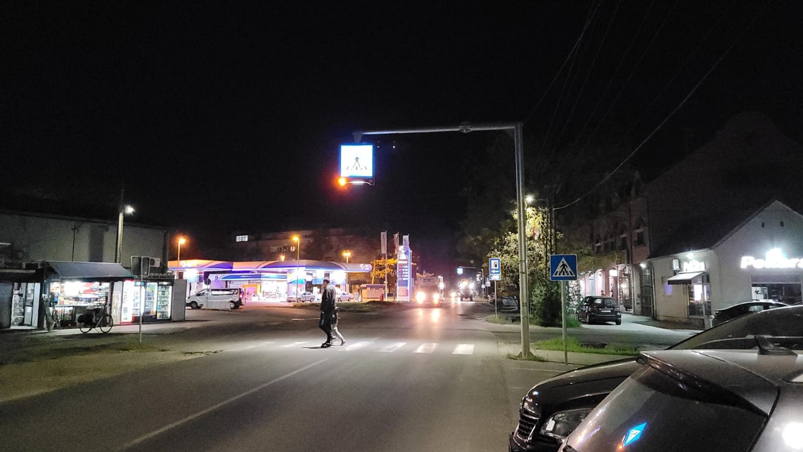 Smart pedestrian crossing at night with the crossing lit